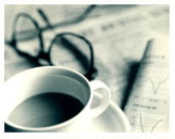 Image of Newspaper, coffee cup and  eyeglasses